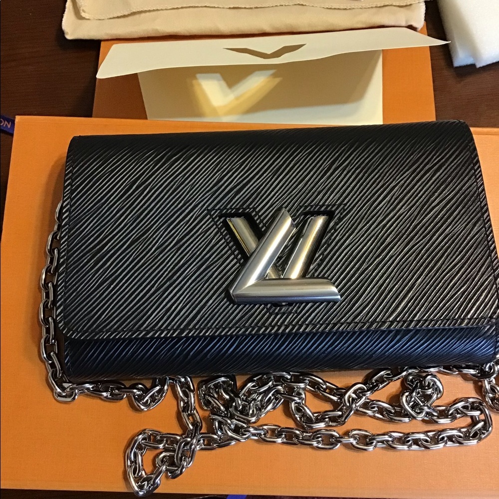 Louis Vuitton twist wallet on chain.